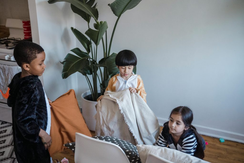 Three children playing at home